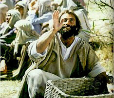 Jesus gives thanks before feeding 5,000 people with five loaves and two fish. (Bruce Marchiano in "Matthew")