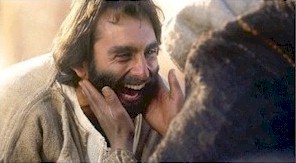 Jesus joyfully heals one of His precious children.  (Bruce Marchiano in "Matthew")